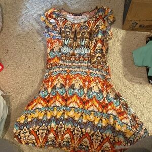 Multi colored pattern dress in a size small by Love Chelsea.